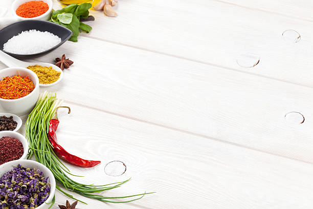 istock Various spices on white wooden background 475297128