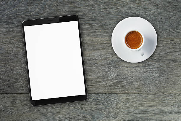 istock collage of generic tablet pc and coffee cup on top 475297548