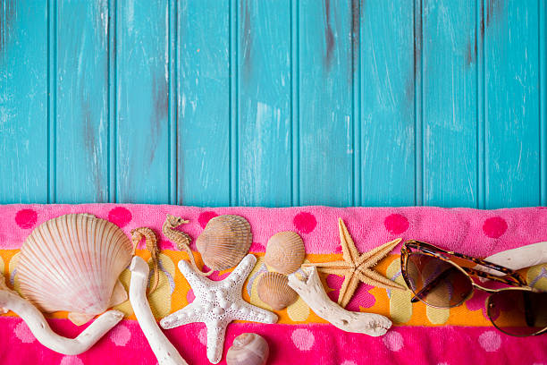 istock Summer vacation scene. Seashells on beach towel. Blue background. 475301210