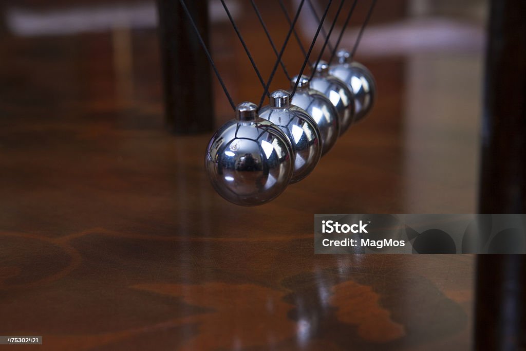 Newton's pendulum Newton's pendulum containing five metal balls Sphere Stock Photo