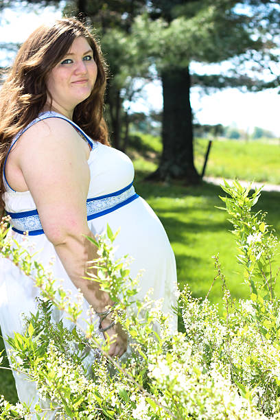 istock Pregnant Woman Posing For Camera 475304178
