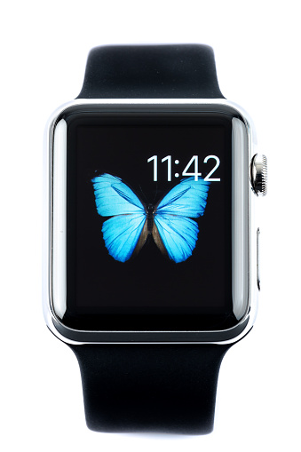 Montreal, Сanada - May 27, 2015: 42mm 316L Stainless Steel Apple Watch with black Sport Band isolated on white background. The Apple Watch became available April 24, 2015 and is the latest device produced by Apple.