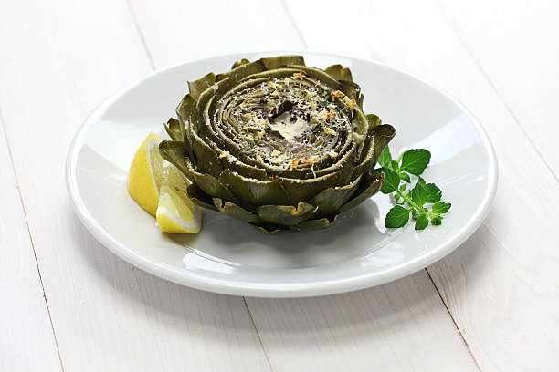 baked artichoke, roasted artichoke baked artichoke, roasted artichoke with cheese and garlic Artichoke stock pictures, royalty-free photos & images
