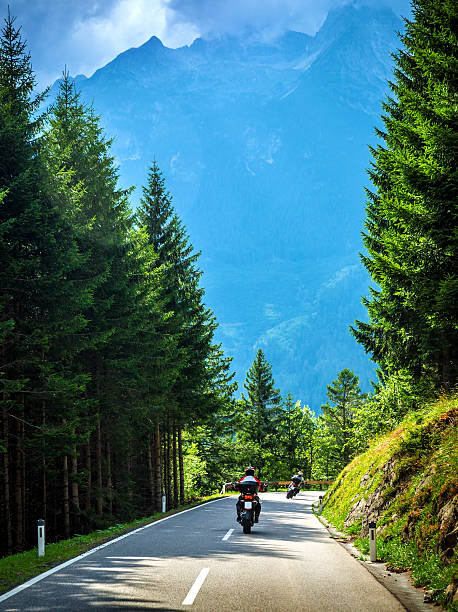 istock Bikers on the road in Alps 475307462