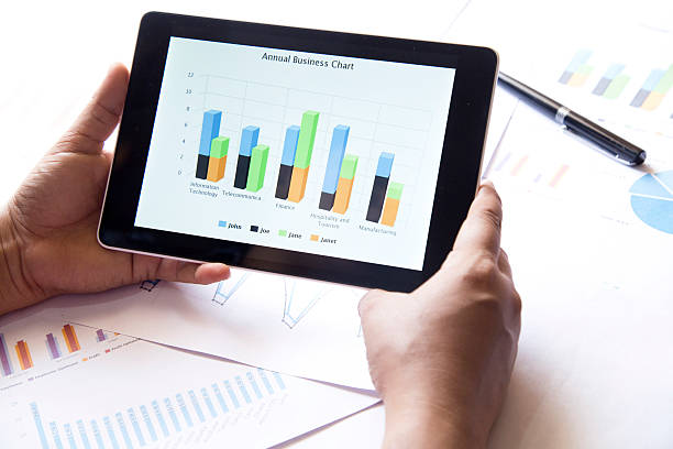 istock Businessman checking business reports on digital tablet 475308326