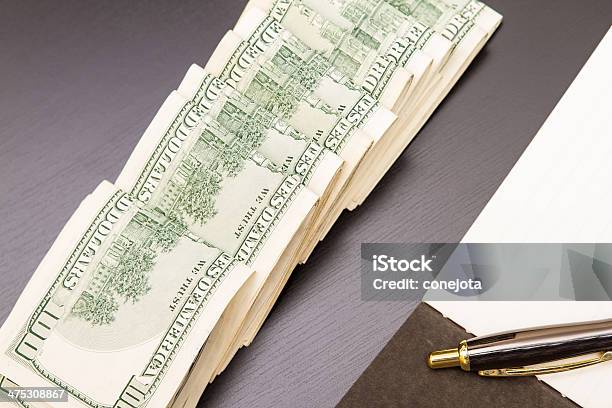 Dollars With A Copybook Stock Photo - Download Image Now - Bank Account, Open, Bank Deposit Slip