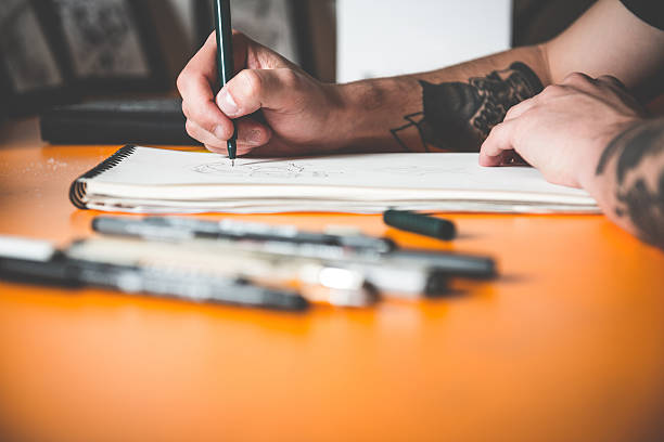 istock Tattoo Artist Drawing 475310894