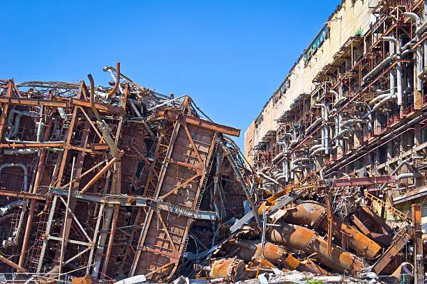 Ruin of an old Fossil-fuel power station, left are seen the destroyed boiler house (steam boiler). Was seen in Saxony, near Leipzig (Lipsia), Thierbach Power Station. Fossil-fuel power stations have machinery to convert the heat energy of combustion into mechanical energy, which then operates an electrical generator.