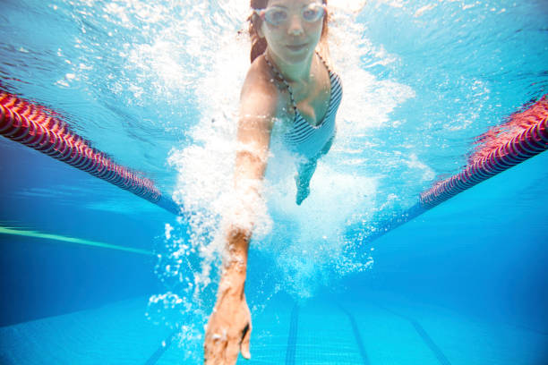 istock Woman swimming 475311814