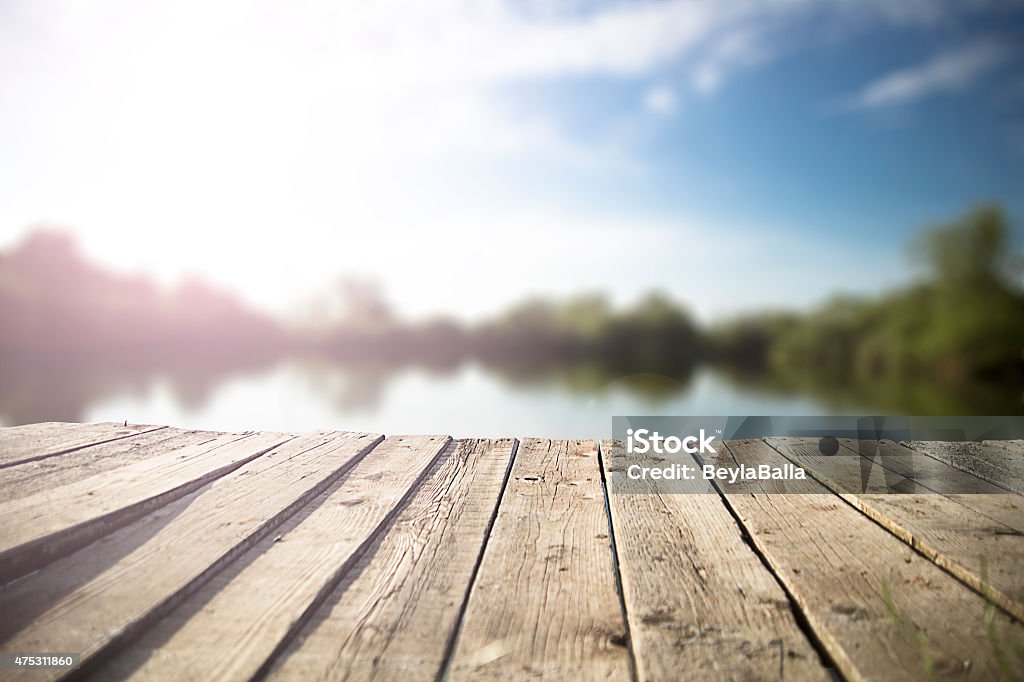 pier old wooden pier on the  lake. Lake Stock Photo