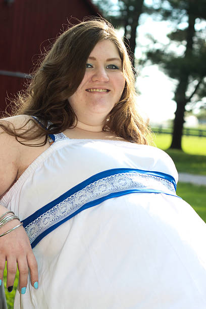 istock Pregnant Woman Smiles For Camera 475312400