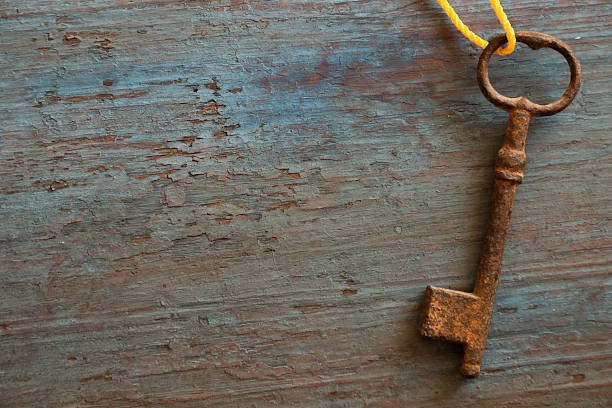 istock old key on the old wooden table 475313108