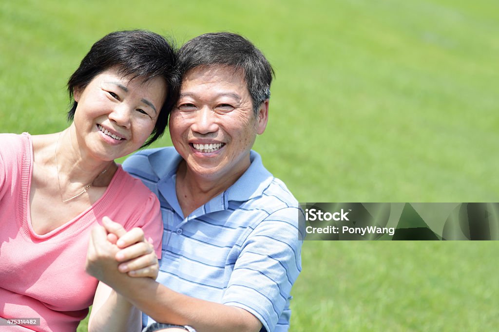 Happy elderly seniors couple Happy elderly seniors couple smile face close up in green grass park, asian people Asia Stock Photo