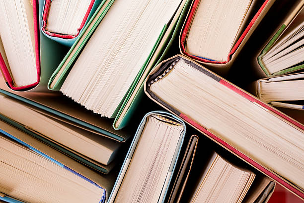 istock High angle view of many hardback books. Library or school. 475314984