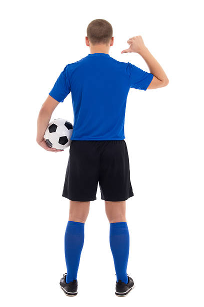 soccer player in blue uniform showing on her back stock photo