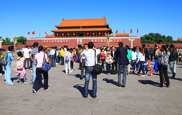 Forbidden City entrance Beijing, China - September 29, 2012: Forbidden City entrance with famouse Tien An Men Gate. Crowd of tourists in foreground, Mao Tse Tung portrait in background forbidden city beijing architecture chinese ethnicity stock pictures, royalty-free photos & images