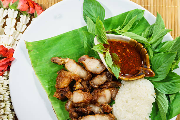 istock fried pork and sticky rice with sauce 475317304