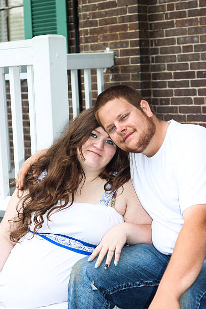 istock Pregnant Wife Poses With Husband 475317504