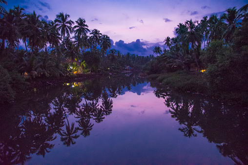 Kerala backwaters in twilight hour. monsoon clouds on the sky shot with Nikon d750