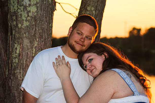istock Husband and Wife Hug Each Other at Sunset 475317578