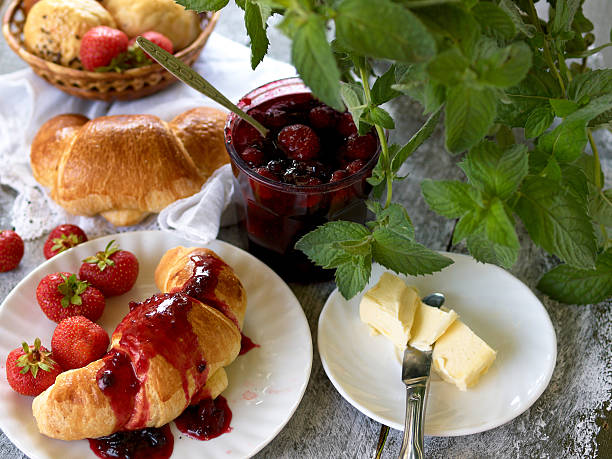 istock Breakfast with croissant,  berry jam, butter and strawberries 475317913