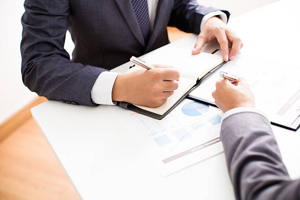 istock Two businessmen looking at report and having a discussion 475320154
