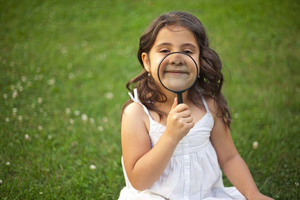 istock Little Girl Exploring Nature 475320385