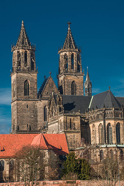 istock Magnificent Cathedral of Magdeburg at river Elbe with blue sky, 475321157