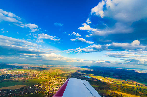 Aerial view of the countryside from a small prop plane, looking over the right wing