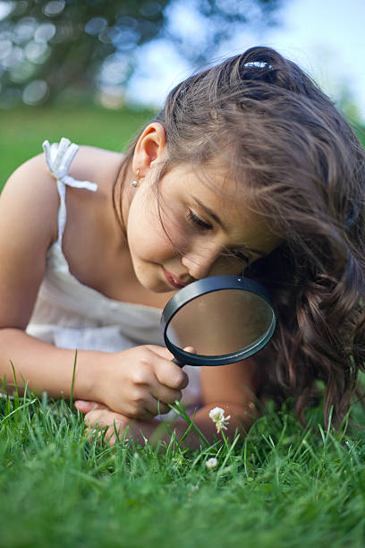 istock Little Girl Exploring Nature 475321469
