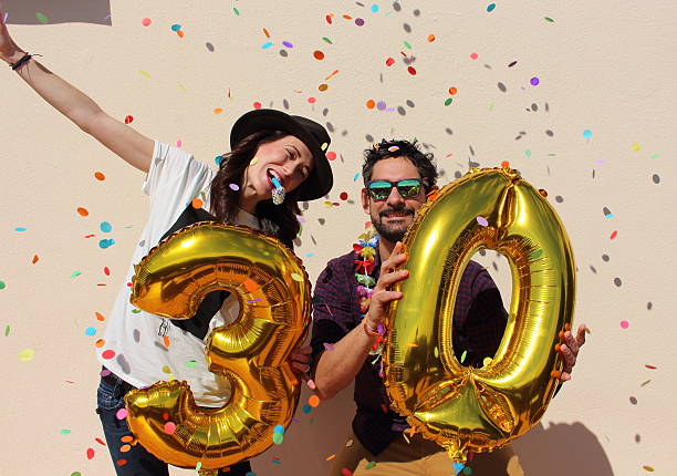 istock Cheerful couple celebrates a thirty years birthday 475325194