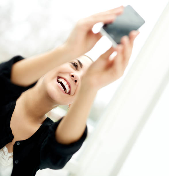 istock Happy lively woman taking her selfie 475326404