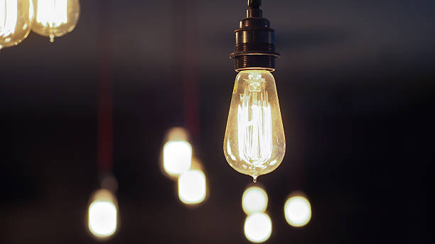 istock Vintage Edison Light Bulbs with closer one focused 475326492