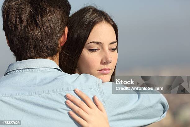 Sad Woman Hugging Her Boyfriend Couple Problems Stock Photo - Download Image Now - Infidelity, Couple - Relationship, Dishonesty