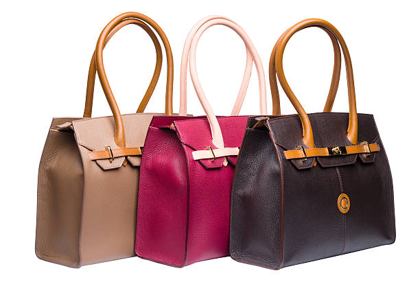 istock Three natural leather female purses isolated on white 475328806