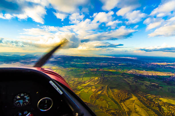 istock Birds eye view from cockpit of small prop plane sunset 475328888