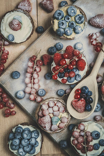 istock Berry tartlets in powdered sugar 475329559