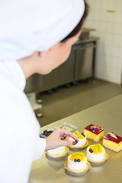istock Confectioner preparing cakes at bakery or confectionery 475333455