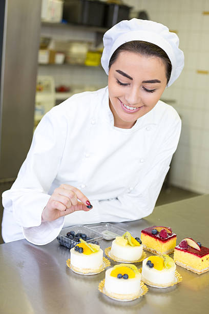 istock Confectioner preparing cakes at bakery or confectionery 475333459