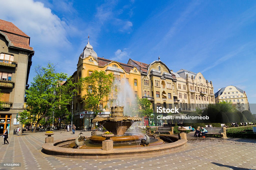 Timisoara- Fish fountain timisoara, europe, romania, architecture, fountain, water, old, landmark, town, travel, people, park, square, vintage, culture, blue, history, fish, colorful, green, famous, facade, monument, sky, stone, detail, victory, photo, vacation Timisoara Stock Photo