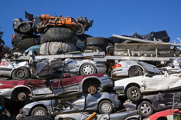 istock Discarded Cars Stacked at Junk Yard. 475334160