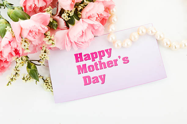 istock Pink carnations and mother's Day gift, greeting cards. 475335327