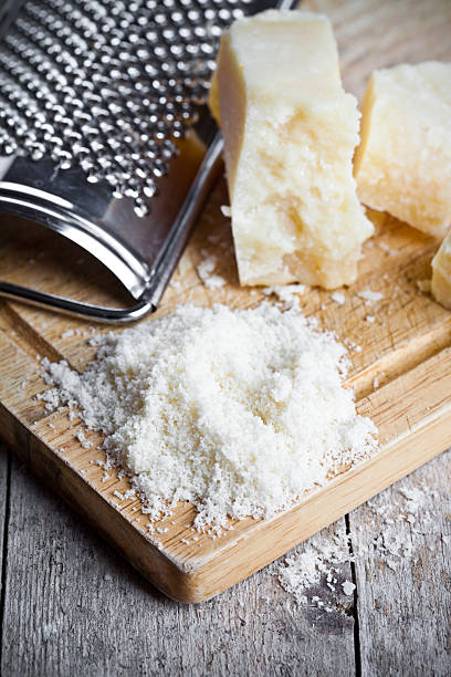 istock grated parmesan cheese and metal grater 475336525