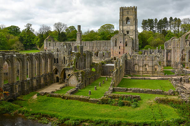 Fountains Abbey, Yorkshire, England Fountains Abbey, located in North Yorkshire, England.  It is also a World Heritage site national trust photos stock pictures, royalty-free photos & images