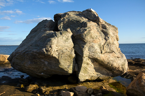 Giant rock on the beach at Long Island Sound of the Atlantic Ocean, Connecticut.