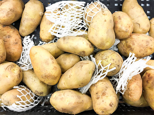istock Yellow raw potatoes in the basket 475337554