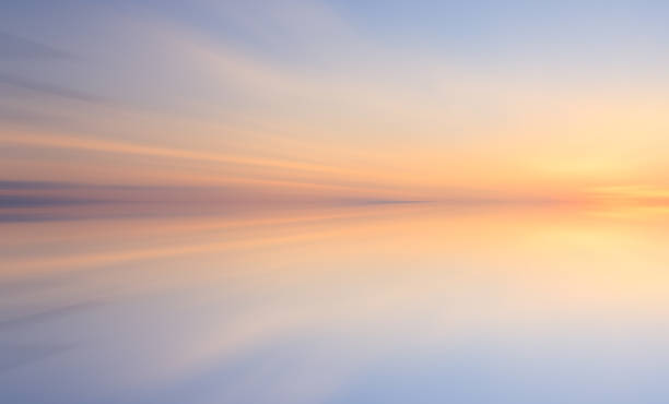 Reflection of colorful sunset with long exposure effect, zoom blurred