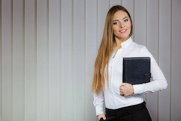 istock Elegant woman with briefcase 475345052