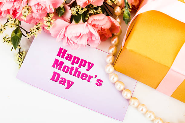 istock Pink carnations and mother's Day gift, greeting cards. 475345955