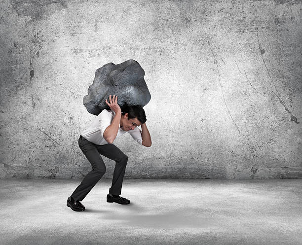 istock Frustrated Young Businessman Carrying Stress 475350236